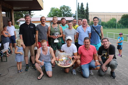 LEUCO managers, Daniel Schrenk (left) and Frank Diez (2nd from left), handing over the coveted challenge cup and a gift basket to the well-deserved winners of the French "Real Beinheim" team.